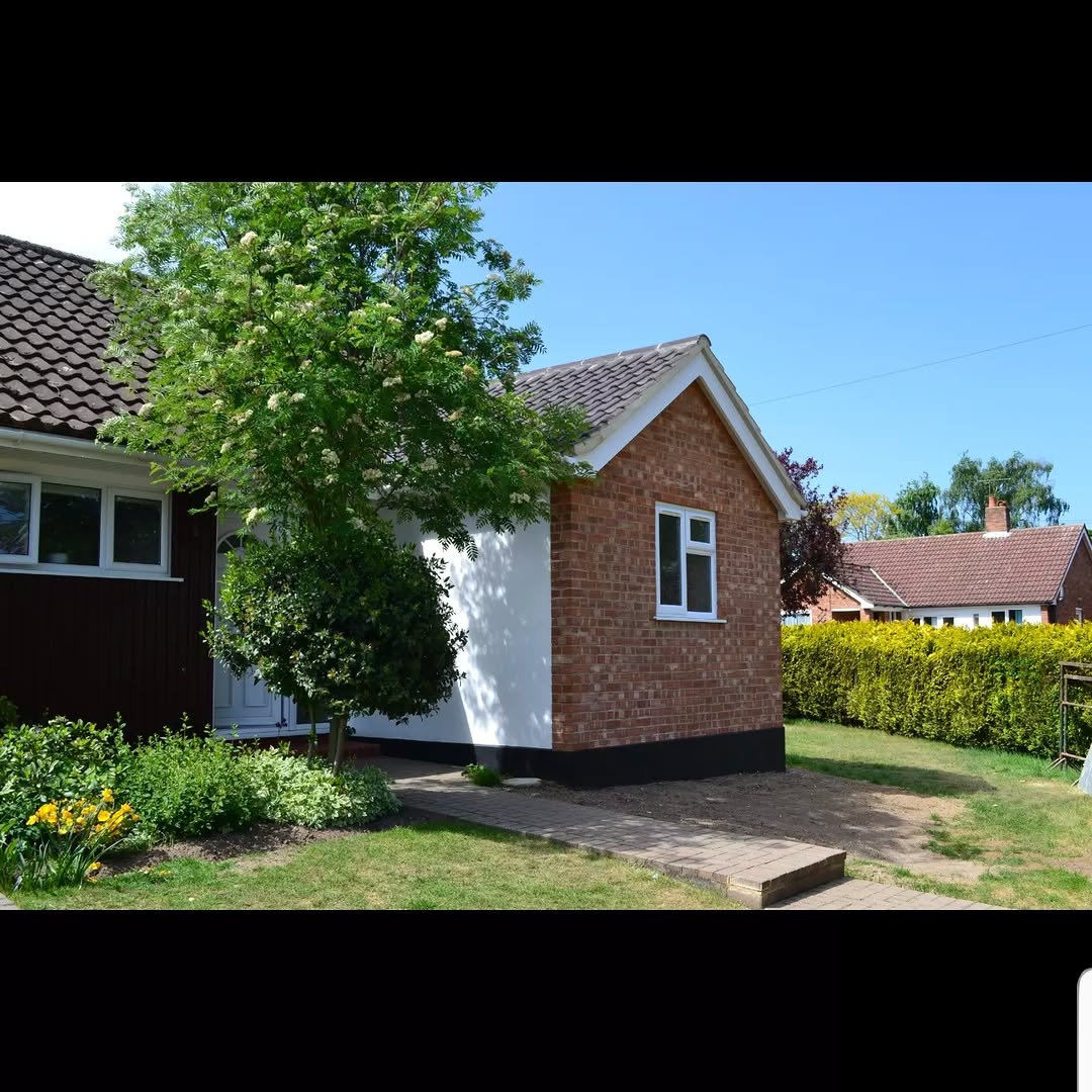 Single-storey brick home extension adding a wet room in Surrey by ADO Builders